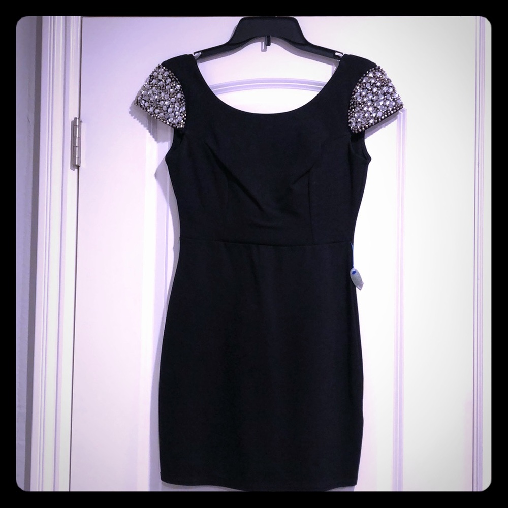 Black mini dress with jeweled shoulders